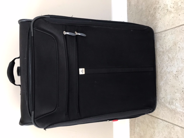 Used     I Used Black Delsey Suitcase